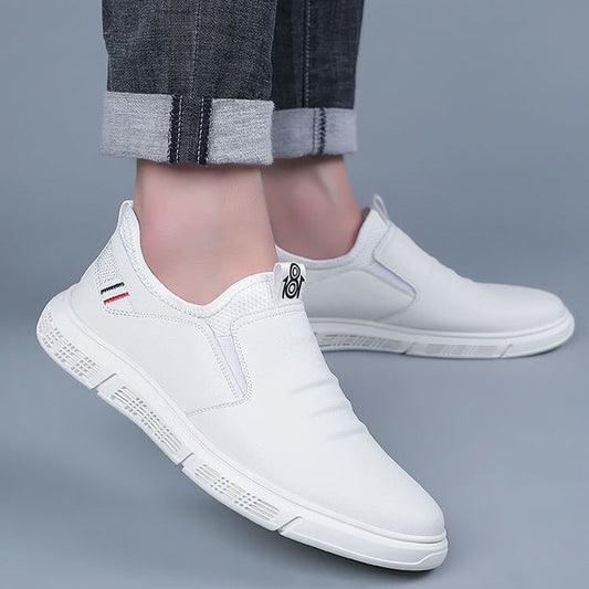 Men's white walking shoes with flat soles and breathable design.